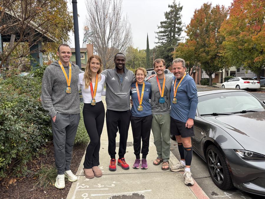 Coach Shaddy with athletes after CIM Marathon PRs